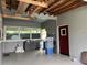 Enclosed porch with storage, a gray exterior, and ample space for organization and outdoor enjoyment at 921 Louisiana Ave, St Cloud, FL 34769