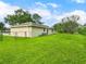Spacious backyard featuring lush green grass, perfect for outdoor activities and relaxation at 12513 Indiana Woods Ln, Orlando, FL 32824