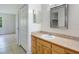 Well-lit bathroom with ample counter space, a vanity, and a door to a bedroom, creating a convenient layout at 12513 Indiana Woods Ln, Orlando, FL 32824
