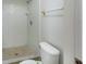 Practical bathroom featuring a tiled shower with updated fixtures, offering a clean and functional space at 12513 Indiana Woods Ln, Orlando, FL 32824