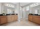 Bathroom featuring double vanities, granite countertops, and a glass-enclosed shower at 12755 Westside Village Loop, Windermere, FL 34786