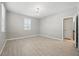 Neutral bedroom features wood-look floors and a window at 12755 Westside Village Loop, Windermere, FL 34786