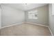 Bright bedroom with wood-look floors and a window at 12755 Westside Village Loop, Windermere, FL 34786