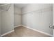 Spacious walk-in closet with wood-look floors and metal shelving at 12755 Westside Village Loop, Windermere, FL 34786