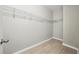 Walk-in closet features wood-look floors and wrap around metal shelving at 12755 Westside Village Loop, Windermere, FL 34786