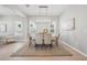 Bright dining area featuring table, chairs, modern light fixture, and neutral decor at 12755 Westside Village Loop, Windermere, FL 34786