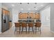 Well-equipped kitchen with an island, seating, and stainless steel appliances at 12755 Westside Village Loop, Windermere, FL 34786