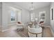 Bright sitting room showcases stylish seating, modern lighting, and bright windows at 12755 Westside Village Loop, Windermere, FL 34786