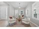 Cozy living room showcasing stylish seating, modern lighting, and bright windows at 12755 Westside Village Loop, Windermere, FL 34786