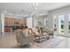 Open-concept living area with kitchen view, ideal for entertaining guests at 12755 Westside Village Loop, Windermere, FL 34786
