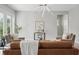 Inviting living room with a comfortable seating arrangement and modern decor at 12755 Westside Village Loop, Windermere, FL 34786
