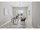 Office space with ample natural light, a modern light fixture, and neutral decor at 12755 Westside Village Loop, Windermere, FL 34786