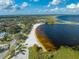 Breathtaking aerial view of beach, palm trees, and nearby lake providing a picturesque scene at 1422 Missouri Ave, St Cloud, FL 34769