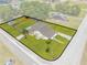 Aerial view of charming single Gathering home featuring a spacious fenced yard with mature trees at 1422 Missouri Ave, St Cloud, FL 34769