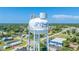 Aerial view of the iconic water tower in a vibrant community, blending small-town charm with modern living at 1422 Missouri Ave, St Cloud, FL 34769
