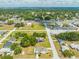 Wide aerial perspective displaying the home and surrounding neighborhood with distant water views at 1422 Missouri Ave, St Cloud, FL 34769
