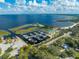 An aerial view of a marina showcasing boat docks, a waterfront restaurant, and lake access at 1422 Missouri Ave, St Cloud, FL 34769