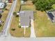 An aerial view displaying the home, backyard, and surrounding neighborhood streets at 1422 Missouri Ave, St Cloud, FL 34769