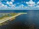 Picturesque aerial view of a lakefront recreational area with a gazebo and walking path at 1422 Missouri Ave, St Cloud, FL 34769
