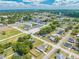 An aerial view of a charming home nestled in a vibrant community with lush greenery and close proximity to the water at 1422 Missouri Ave, St Cloud, FL 34769