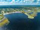 Scenic aerial of a lakefront beach and marina, offering a variety of recreational opportunities at 1422 Missouri Ave, St Cloud, FL 34769