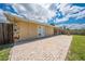 Exterior view of the backyard featuring brick patio and fence at 1422 Missouri Ave, St Cloud, FL 34769