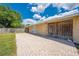 Exterior view of the backyard featuring brick patio and partial fence at 1422 Missouri Ave, St Cloud, FL 34769