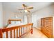 A bedroom featuring wood floors, white walls and a ceiling fan at 1422 Missouri Ave, St Cloud, FL 34769