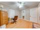 Bedroom with hardwood floors, ceiling fan, closet, natural lighting, and adjacent mirror door at 1422 Missouri Ave, St Cloud, FL 34769