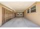 Attached carport with concrete flooring and paneled enclosure at 1422 Missouri Ave, St Cloud, FL 34769