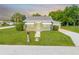 Charming home featuring a stone walkway leading to the front door and well-maintained landscaping at 1422 Missouri Ave, St Cloud, FL 34769
