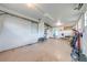 Spacious two car garage with overhead lights, multiple windows, and access to other rooms at 1422 Missouri Ave, St Cloud, FL 34769