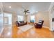 Bright living room featuring hardwood floors, neutral paint, and comfortable leather furniture at 1422 Missouri Ave, St Cloud, FL 34769