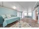 Bright living room with brick floors, daybed, and French doors leading to the exterior at 1422 Missouri Ave, St Cloud, FL 34769