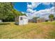 Exterior shot of backyard shed and fencing at 1422 Missouri Ave, St Cloud, FL 34769