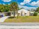 This is a charming home featuring a side driveway, mature landscaping and a cozy, inviting aesthetic at 1422 Missouri Ave, St Cloud, FL 34769
