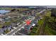 Aerial view showcases the neighborhood layout and the home's placement within it at 164 Emanuelle Dr, Winter Haven, FL 33884