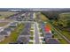 Aerial view showcases the neighborhood layout and the home's placement within it at 164 Emanuelle Dr, Winter Haven, FL 33884