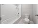 Bright bathroom with a bathtub shower combination with white tile surround at 164 Emanuelle Dr, Winter Haven, FL 33884