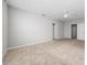 A spacious bedroom with neutral paint and two doors, with ceiling fan at 164 Emanuelle Dr, Winter Haven, FL 33884