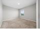 Light and airy bedroom with carpet and large window at 164 Emanuelle Dr, Winter Haven, FL 33884