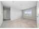 Bright bedroom with carpet and window offering a view of the outdoors at 164 Emanuelle Dr, Winter Haven, FL 33884