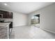 Open kitchen featuring stainless appliances, a center island, and sliding glass doors at 164 Emanuelle Dr, Winter Haven, FL 33884