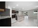 Open kitchen featuring stainless appliances, center island, and tile flooring at 164 Emanuelle Dr, Winter Haven, FL 33884