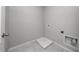 Functional laundry room with washer and dryer hookups and tile flooring at 164 Emanuelle Dr, Winter Haven, FL 33884