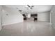 The living room is open to the kitchen, and it has stairs leading to the upper floor at 164 Emanuelle Dr, Winter Haven, FL 33884