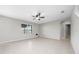 Bright living room featuring tile floors, a window, and an archway at 164 Emanuelle Dr, Winter Haven, FL 33884
