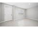 The bright living room offers tile floors, a large window and white trim at 164 Emanuelle Dr, Winter Haven, FL 33884