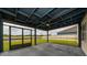 View of a screened-in patio with a ceiling fan overlooking the backyard at 164 Emanuelle Dr, Winter Haven, FL 33884