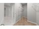 A neutral colored walk-in closet with standard shelving for clothing storage at 164 Emanuelle Dr, Winter Haven, FL 33884